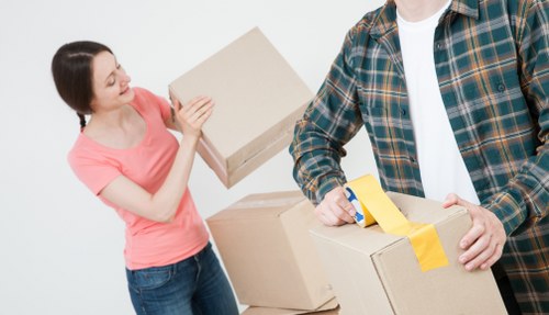 Professional movers handling office equipment in Uxbridge