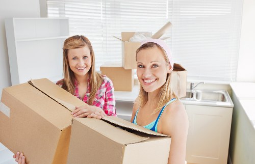 Professional movers handling furniture carefully