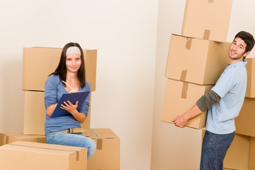 Professional moving team loading belongings into a truck